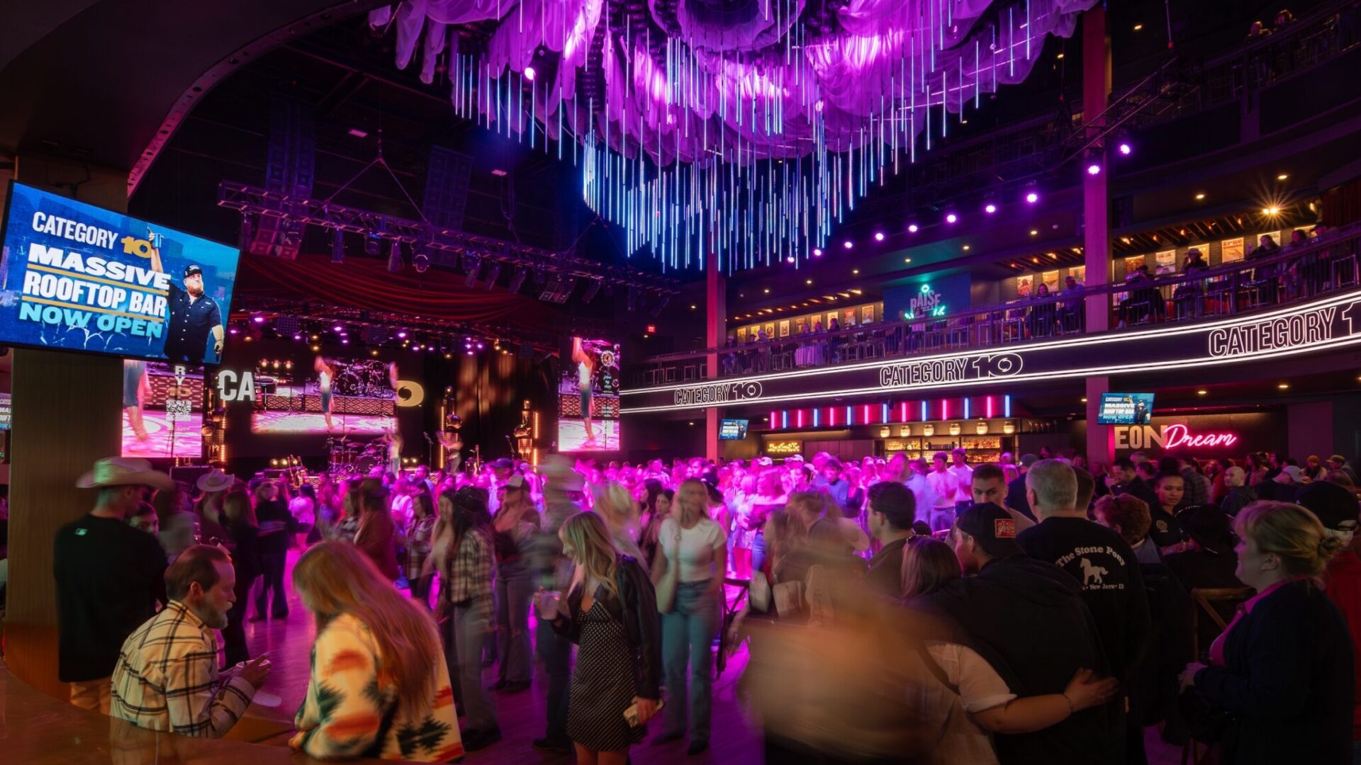 Fans enjoying live music at Category 10 immersive brand destination.